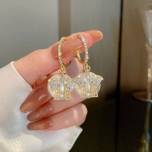White big pearl bow earring Buy Earrings Online in India | Stylish Earrings for Women & Girls | Korean, Daily Wear, Party Wear, Budget & Premium Jewellery | Oora by Zivya